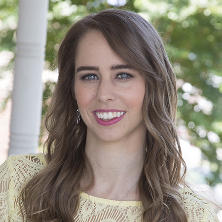 Dr. Brenna Grant Squires smiles as she poses for a headshot. She is a psychologist at Sheltering Oaks Counseling that offers personality testing in Tampa, FL. Contact our practice or search "personality testing near me" to learn more. 